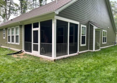 This project created a screened in porch from an existing rear patio. The rails were built with white Westbury composite wood for a home in Chesterfield, VA