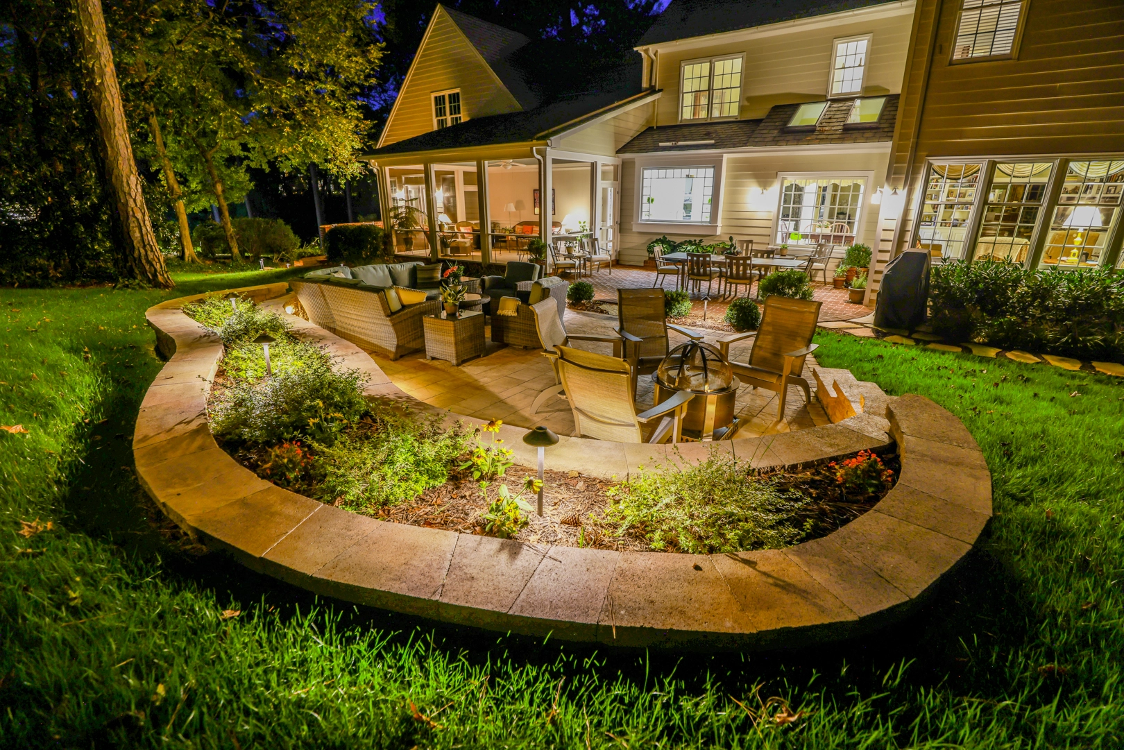 custom outdoor patio with outdoor lighting and furniture.